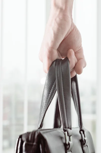 Black leather bag in hand business man — Stock Photo, Image