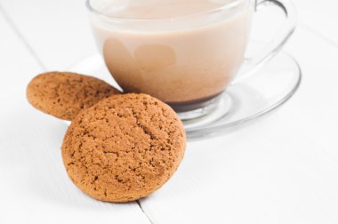 oatmeal cookie with coffee wooden white background clipart