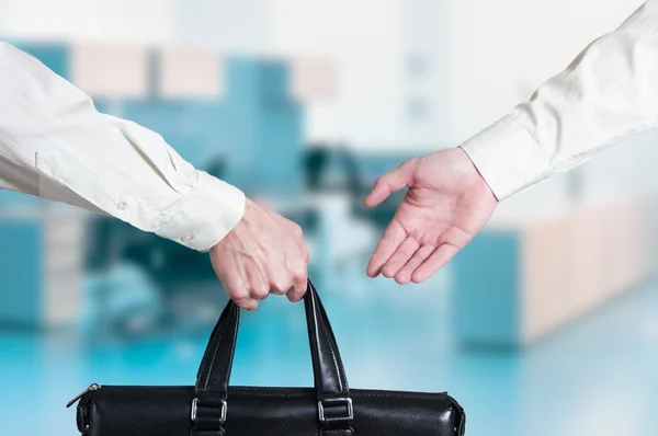 Business transfer deal. handover of a suitcase for money partners — Stock Photo, Image