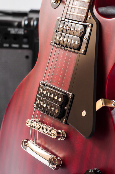 Detail of six-string electric guitar closeup, selective focus.