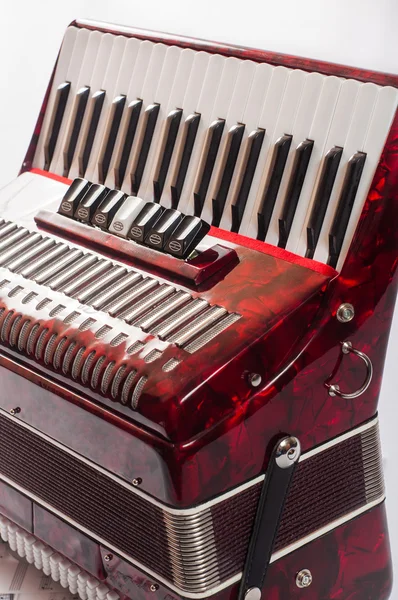Partie accordéon instrument de musique rouge, fond blanc — Photo