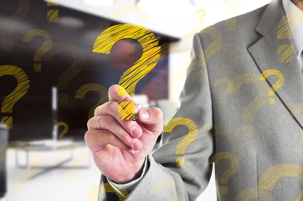 Businessman drawing a yellow question mark. Business concept — Stock Photo, Image