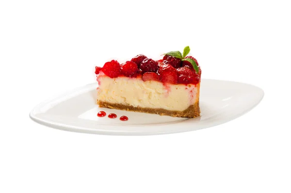 Cake with fresh culinary herbs strawberries on white plate — Stock Photo, Image