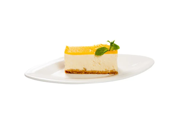 Lemon tart on a plate with fresh mint leaf — Stock Photo, Image