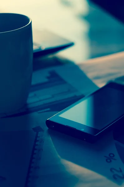 Smartphone on Laptop and wooden table. The view from the top — Stock Photo, Image