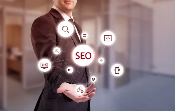 Search optimization business pointing finnger selecting seo — Stock Photo, Image