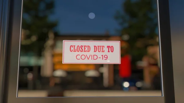 Primer plano en un letrero cerrado en la ventana de una tienda que muestra el mensaje Cerrado debido a Covid-19. El vidrio refleja la ciudad del día. renderizado 3d — Foto de Stock