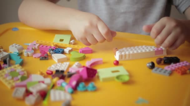 Close up of kid hand moving lego construction 2 — Stock Video