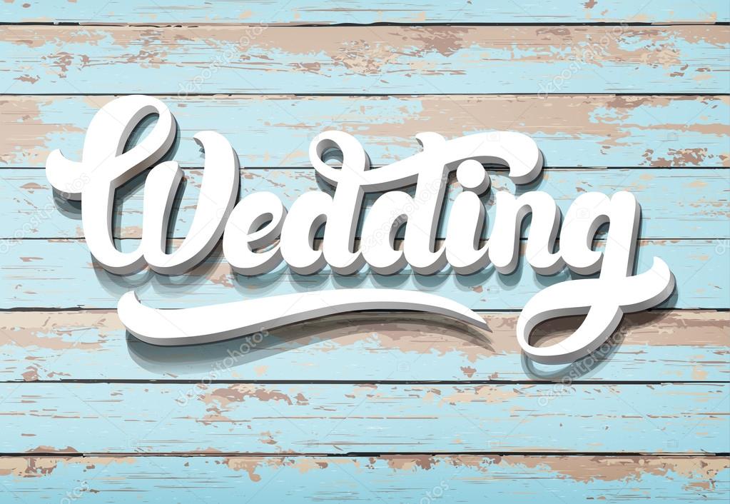 The word Wedding on a wooden background