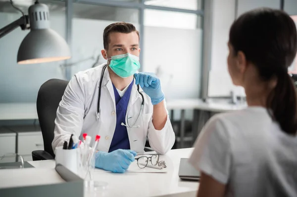 Before the flu epidemic, the doctor shows his patient the vaccine that she will be vaccinated with