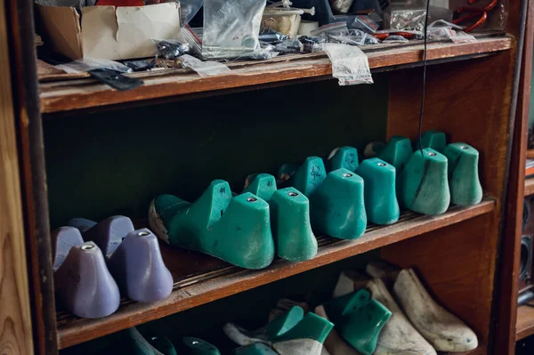 In the shoe shop in the rack is a lot of blanks for different shoes