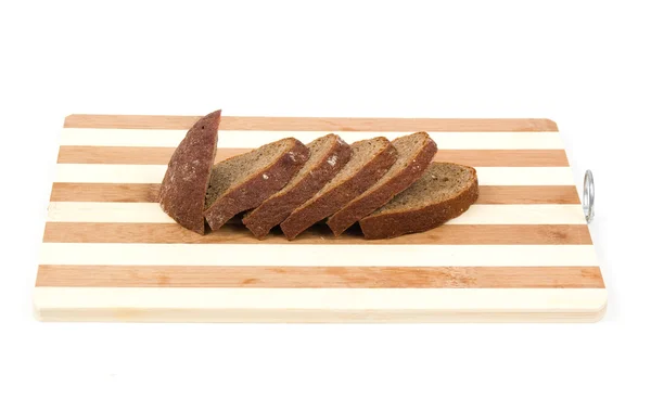 Sliced bread on a hardboard isolated on white — Stock Photo, Image