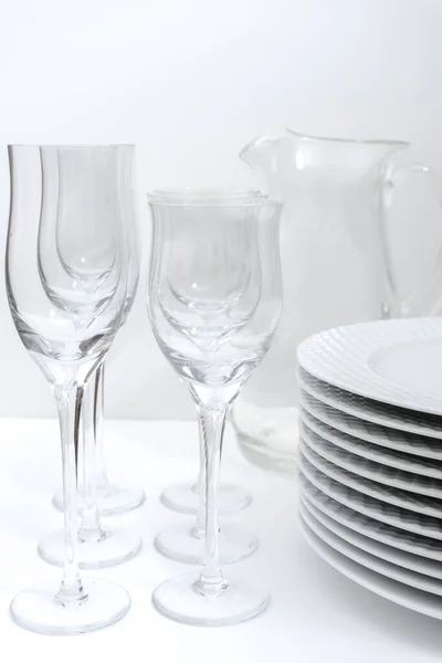 Set Stacked Plates Crystal Stemware Glass Jug White Table — Stock Photo, Image