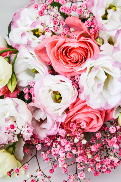 bouquet of pink and white roses and different flowers. close up, selective focus, background for Valentine's Day decoration. flower background. holiday greeting card