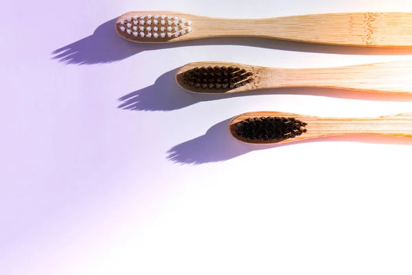 stock image Bamboo toothbrush. Biodegradable, organic on a white background with deep trendy shadows. Eco friendly life style concept, zero waste