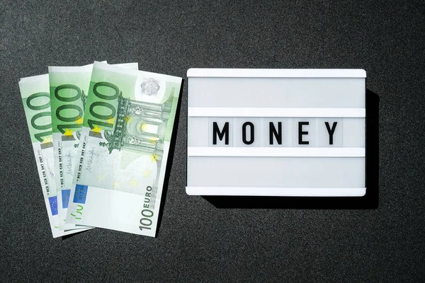 Πλακέτα Lightbox Λέξη Money Μαύρα Γράμματα Γύρω Από Τραπεζογραμμάτια Ευρώ — Φωτογραφία Αρχείου