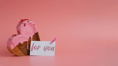 FOR YOU message on paper note greeting card Delicious fresh croissant topped with colorful flavor Ganache. Creation unique heart shape bakery. Puff pastry holiday love gift present idea Valentines