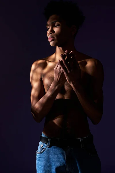 Portrait of transgender hispanic model with naked torso. Trans gender young man standing in shadow — Stock Photo, Image