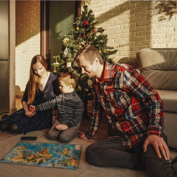 Happy family playing board game walker