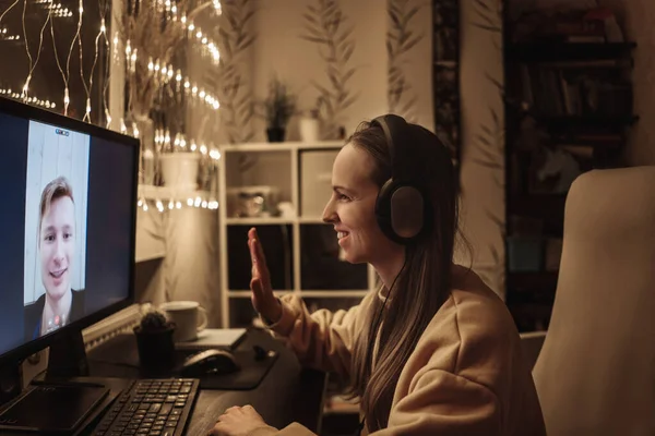 Woman making video call to man using computer.