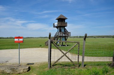 Andau, Austria - May 04, 2021: Lookout tower at the border crossing point with remains of the barbed wire fence  named - Iron Curtain - along the Austro-Hungarian border in Burgenland clipart