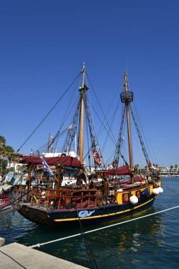 Kos, Greece - September 16, 2025: Unknown tourists in excursion boat to the neighboring islands in the city's harbor