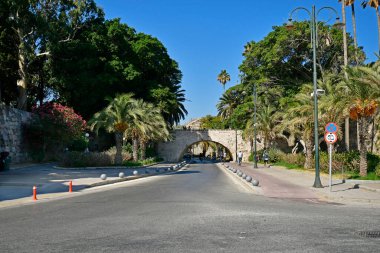 Kos, Greece - September 16, 2025:  Stone bridge for pedestrians to the old Neratzia castle complex on the promenade in Kos town