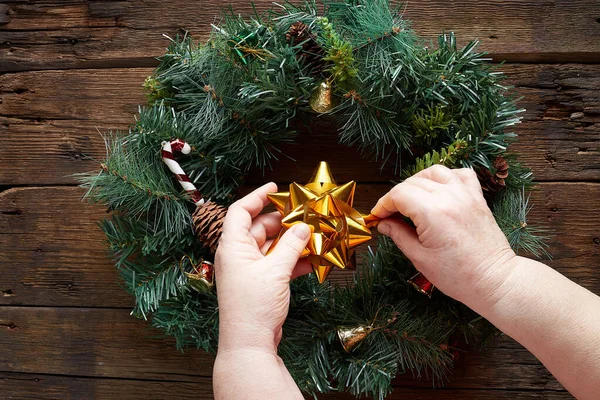 Christmas Wreath Wooden Background Grandma Hands — Stock Photo, Image