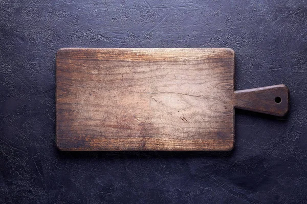 Old Chopping Board on Dark Concrete Background, copy space for your text