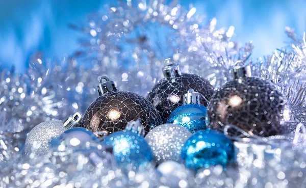 Christmas balls in tinsel — Stock Photo, Image