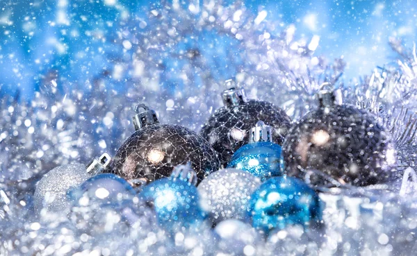 Christmas balls in tinsel — Stock Photo, Image