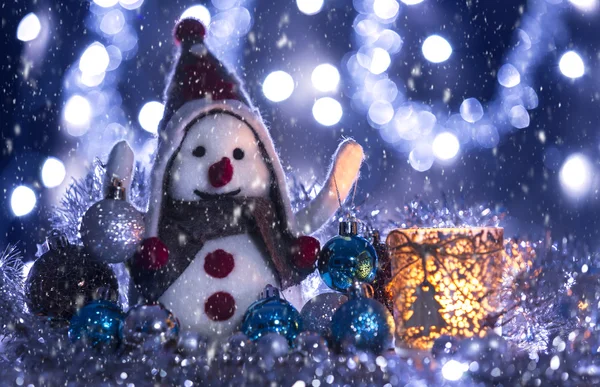 Snowman brought Christmas balls — Stock Photo, Image