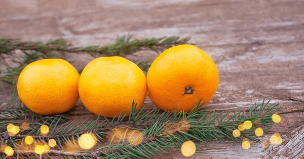 Three Ripe Tangerines Fir Branches Old Wooden Table — Stock Photo, Image