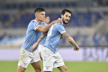  ROME, ITALY - 24 Ekim 2020: Luis Alberto (R) İtalyan Serisi 'nde SS Lazio ile Bologna FC arasında 24 Ekim 2020' de Roma 'da oynanan İtalya / LM Stadyumu' nda oynanan futbol maçında gol attı.