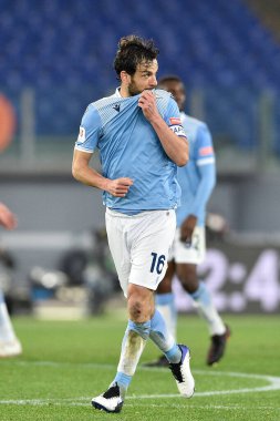 ROME, ITALY - 21 Ocak: SS Lazio 'dan Marco Parolo (16 Ocak), SS Lazio ile Parma arasında 21 Ocak 2021' de İtalya / LiveMedia 'da oynanan Stadio Olimpico' da oynanan 8. TIM Kupası maçında gol attıktan sonra kutluyor.