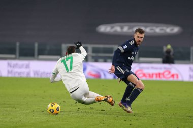 8 Aaron Ramsey (Juventus FC) ve Mert Muldur (Sassuolo) Juventus FC ve US Sassuolo - İtalyan futbol takımı Serie A maçı Torino, İtalya 'da, 10 Ocak 2021 - Fotoğraf: LM / Claudio Benedetto