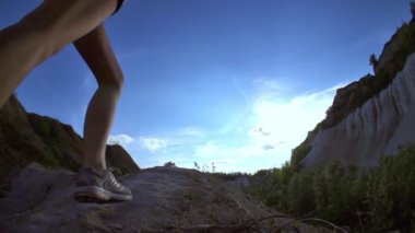 Woman hiking and climbing