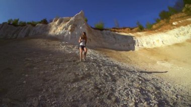 Woman hiking and climbing