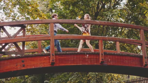 Happy loving couple on bridge — Stock Video