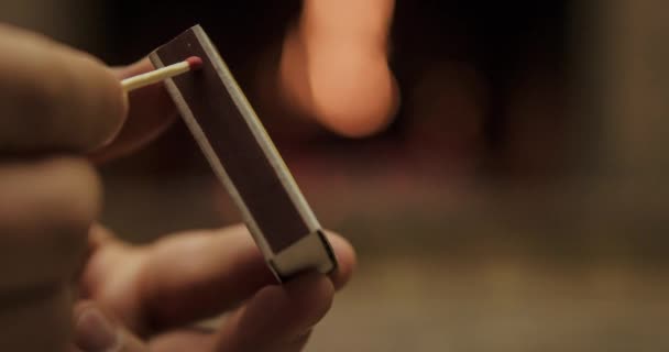 Striking and lighting wooden match — Stock Video
