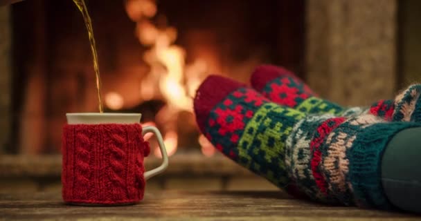 Woman relaxes by warm fire — Stock Video