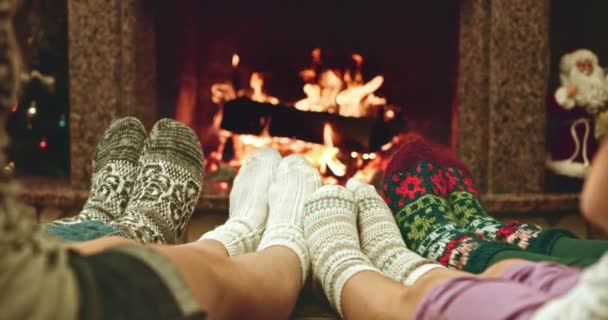 Feet warming by cozy fire — Stock Video