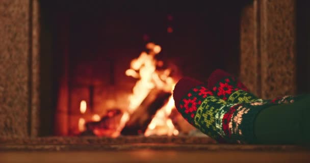 Woman relaxes by warm fire — Stock Video