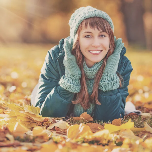 Happy young woman in the autumn park Stock Photo