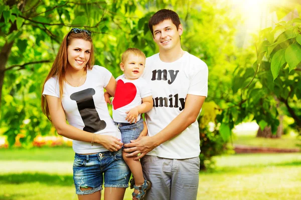 Young family having fun in  summer park — Stock Photo, Image