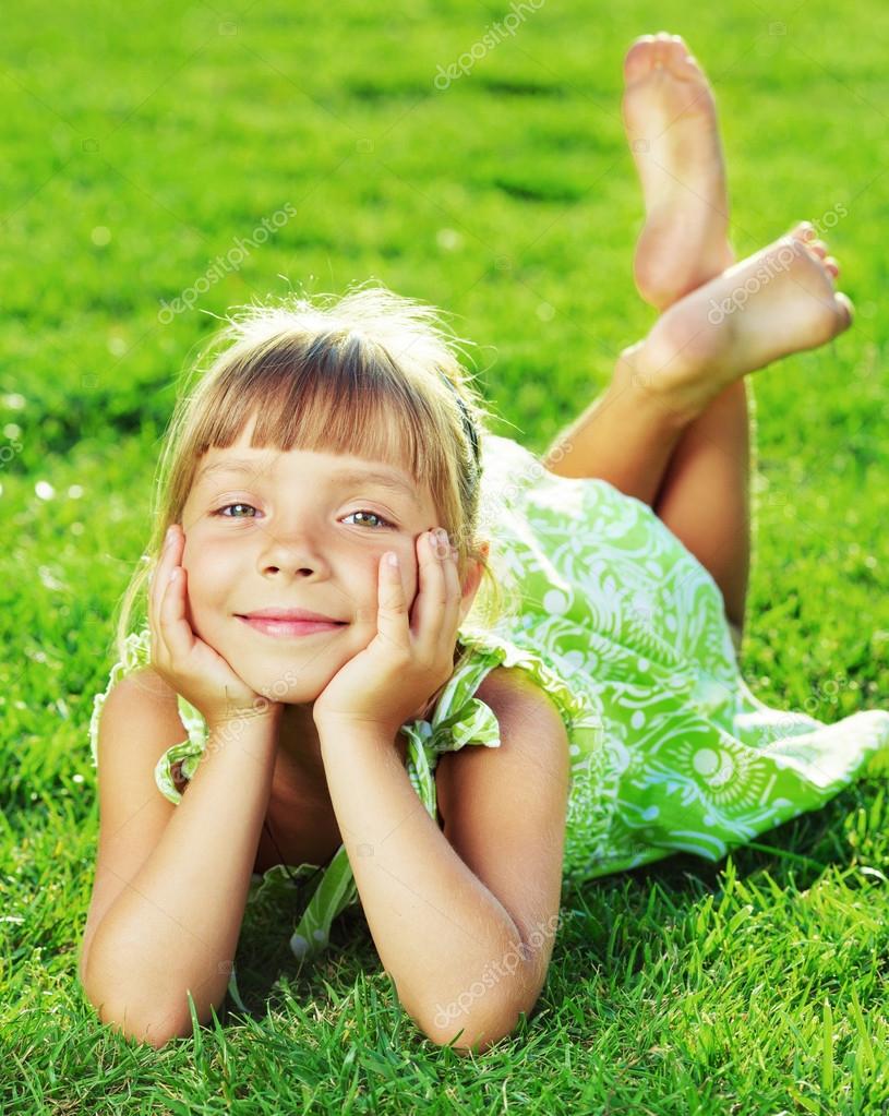 Girl Laying In Grass