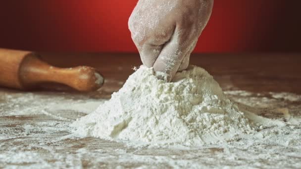 hand preparing flour