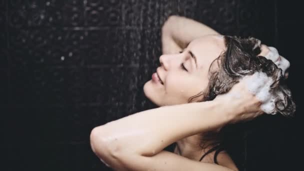 Woman washing her hair — Stock Video