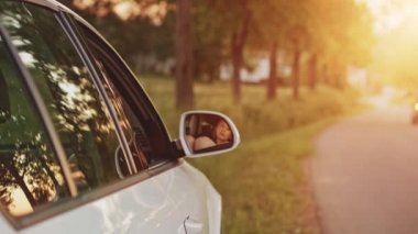 Woman showing legs from car