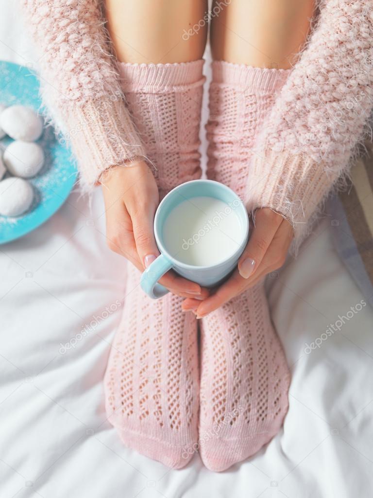 Woman relaxing at cozy home atmosphere